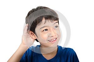 Little boy lissening by hand up to the ear on white background