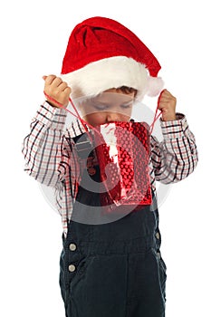 Little boy with little Christmas gift bag