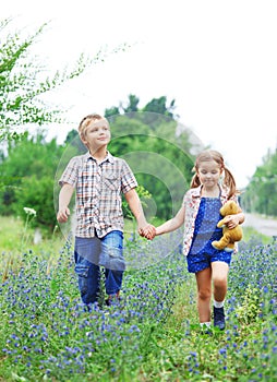 Little boy and little girl with walking