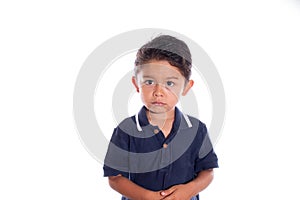 Little boy with look of sadness and regret, isolated on white background. Latin child afraid of being punished. Being