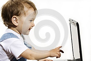 Little Boy looking at Laptop screen