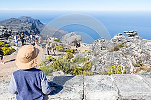 Little boy looking at the ocean view from top of Table Mountain