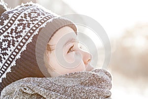 Little boy looking up the sky in winter