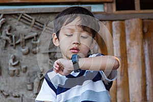 Little boy looking watches