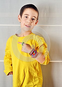 Little boy with loom band bracelets