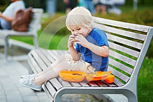 Little boy with lunchbox and healthy snack