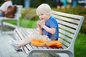 Little boy with lunchbox and healthy snack