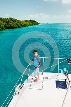 Little boy at luxury yacht