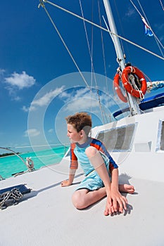 Little boy at luxury yacht