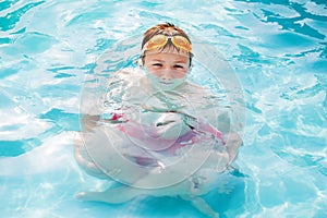 Little boy with magnified body in water refraction photo