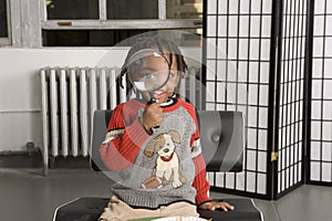 Little boy with a magnifying glass