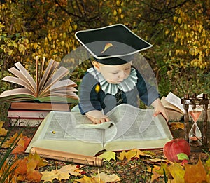 Little boy with many books in park collage