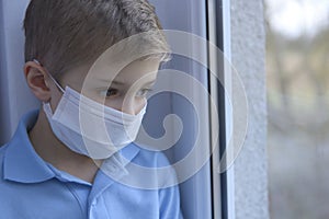 Little boy in a medical mask.