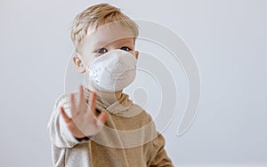 Little boy in medical mask stopping disease