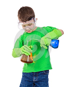 Little boy mixing a chemical liquids