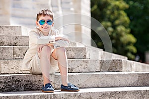 Little boy in a nice suit and glasses. Children portrait