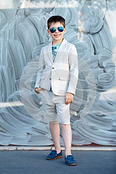 Little boy in a nice suit and glasses. Children portrait