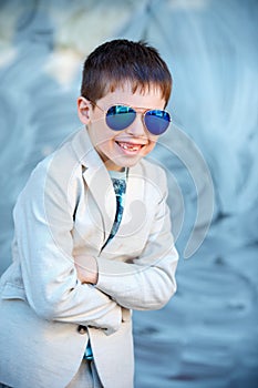 Little boy in a nice suit and glasses. Children portrait