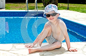 Little boy oiled up with sun cream