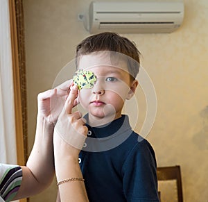 Little boy with okluder on the eye