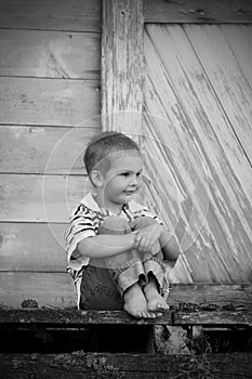 Little boy on old dock (BW)