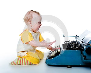 Little boy with the old typewriter