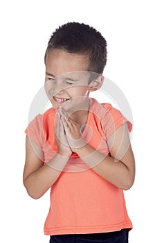 Little boy with organge shirt praying