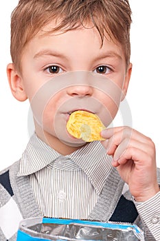 Little boy with packet potato chips