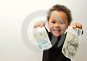 Little boy with paper money