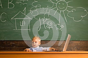 Little boy perform internet surfing on laptop computer. Preschool child use internet surfing for school research