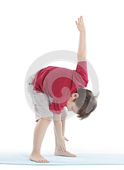 Little boy performs an exercise to stretch the muscles.isolated on white