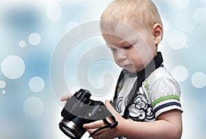 Little boy with photo camera