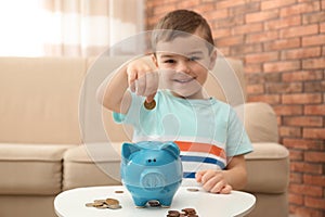 Little boy with piggy bank and money