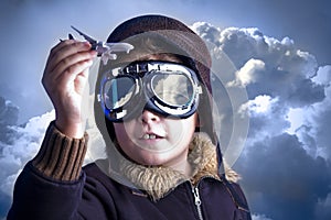 Little boy in the pilot`s hat