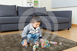 Little boy play toy block