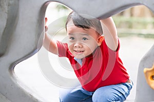 Little boy in playhouse