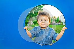 Little boy in playhouse