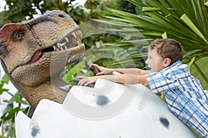 Little boy playing in the adventure dino park