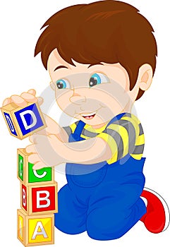 Little boy playing with alphabet block
