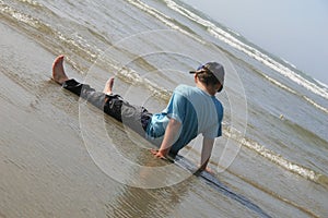 Little boy playing on beach
