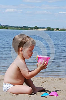 Little boy playing on the beach