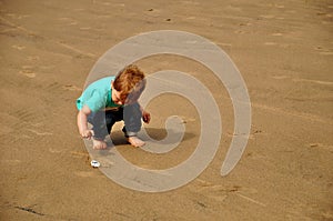 Little boy playing on the beach