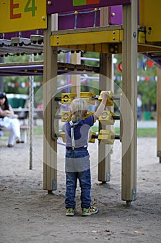 Little boy playing with blocks on the playground