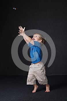 Little boy playing with bubble