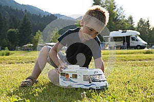 Little boy playing at camping site