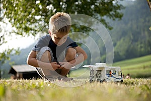 Little boy playing at camping site