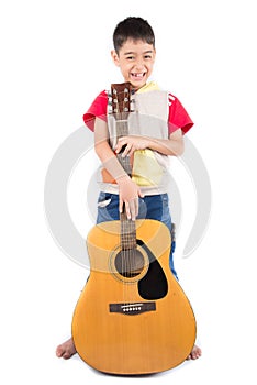 Little boy playing classic guitar course on white background