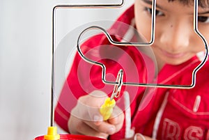 Little boy playing coil spark with concentrate photo