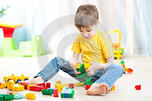 Little boy playing with cubes