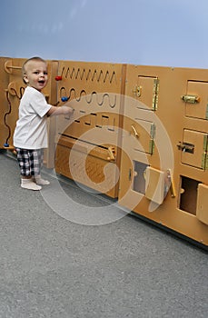 Little boy playing developing game